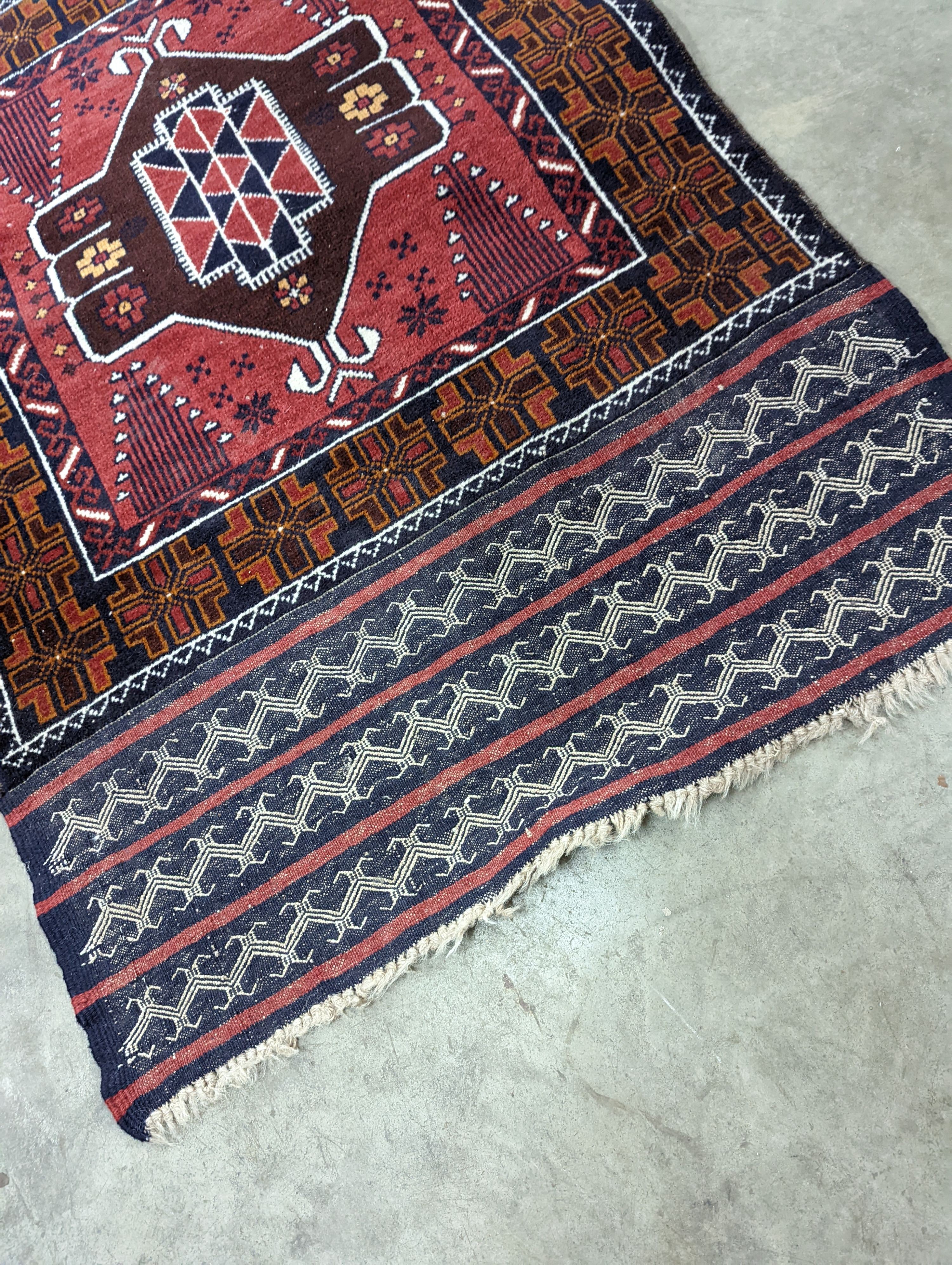 A Belouch geometric prayer rug and two Caucasian design rugs, largest 152 x 104cm